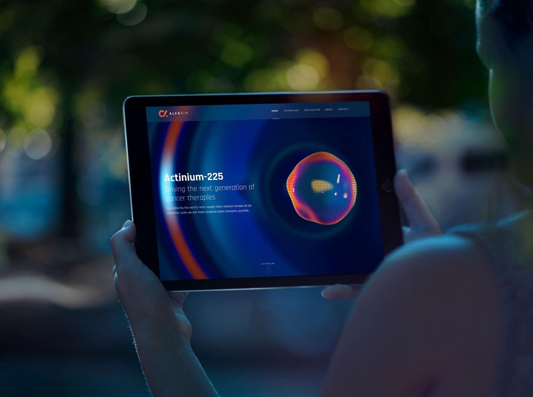 tablet in hands displaying alfarim website