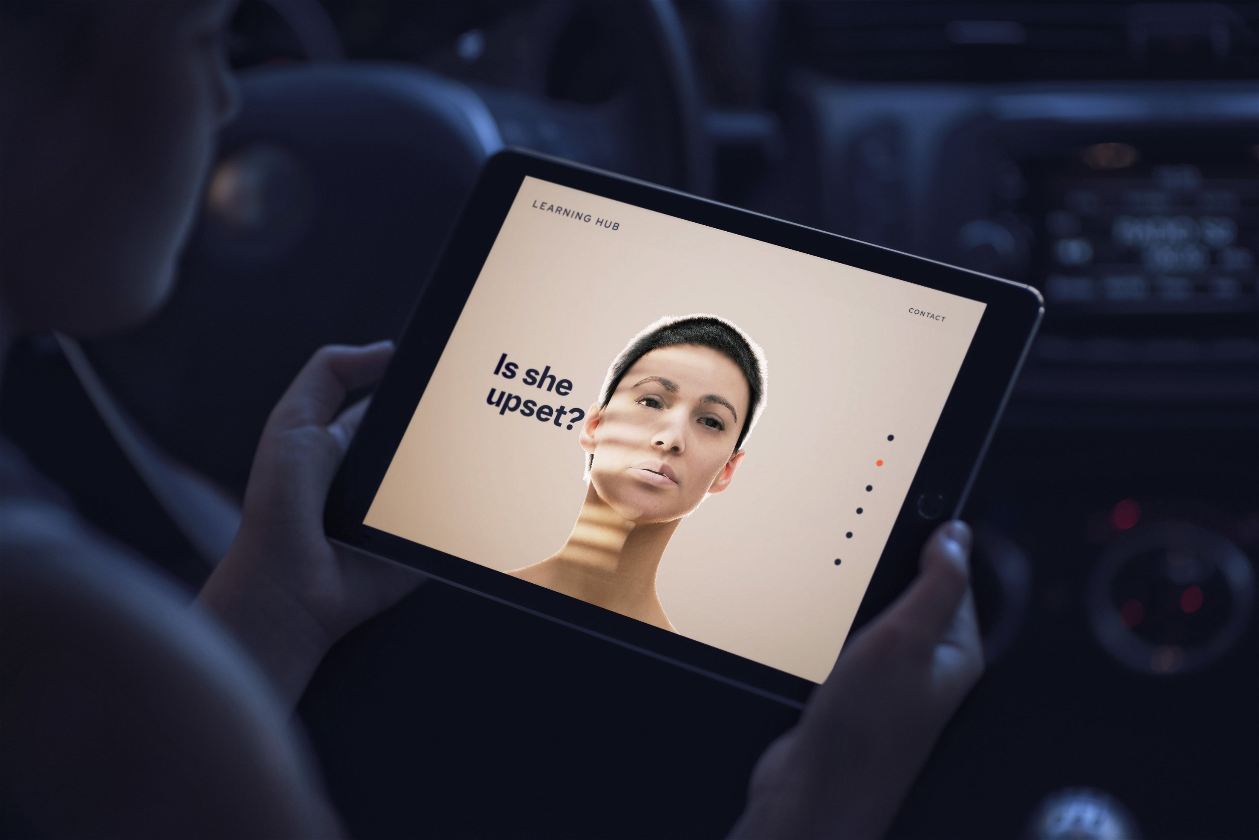 Person looking at ipad with health platform by sensu health.jpg
