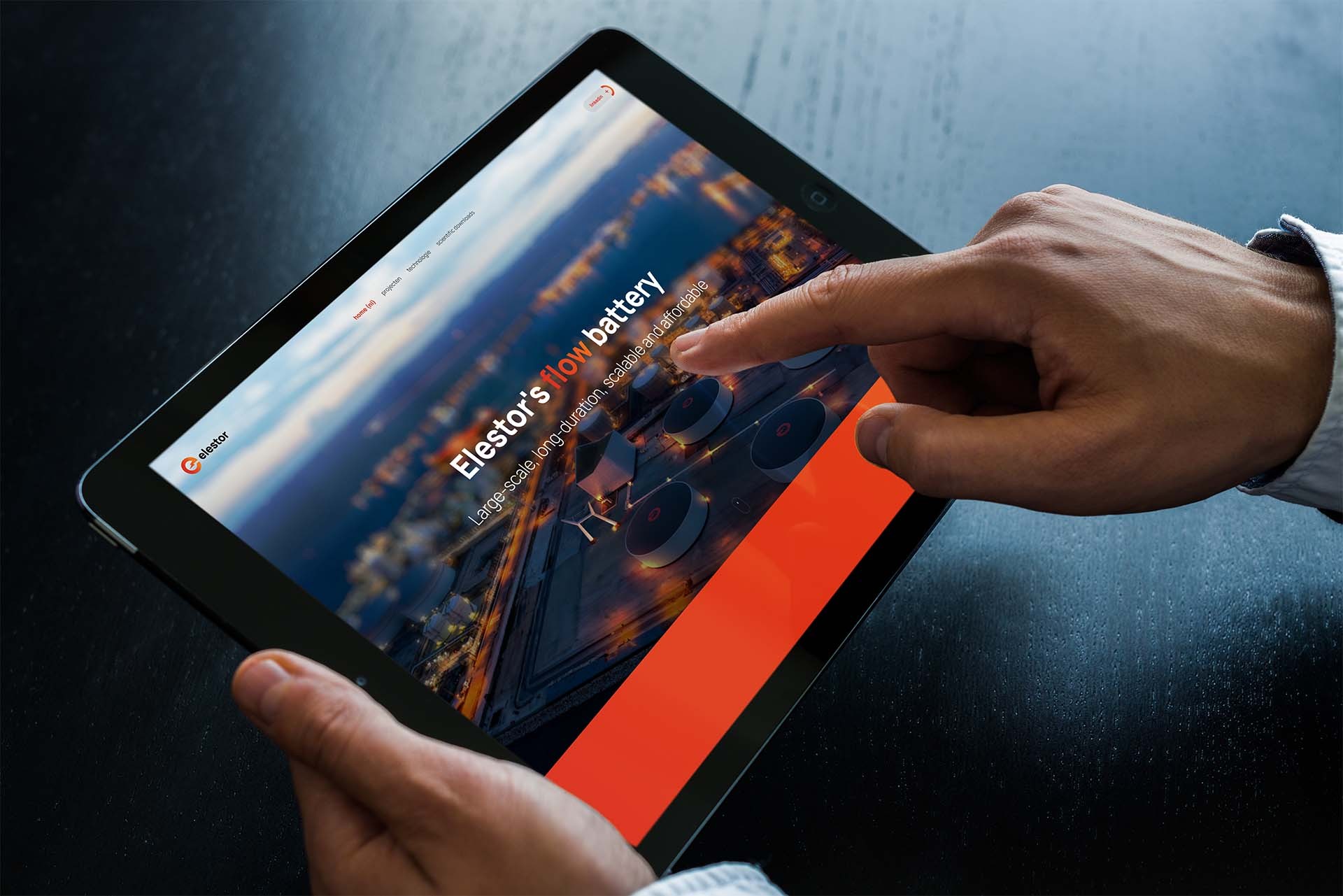 Mock up of the Elestor website with hands.jpg